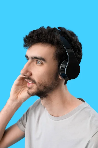 Young Brunette Man Headphones Blue Background Closeup — Stock Photo, Image