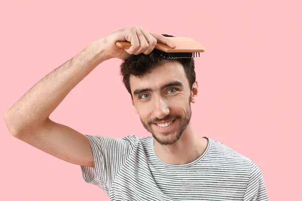 Young Brunette Man Brushing Hair Pink Background Closeup — Stock Photo, Image