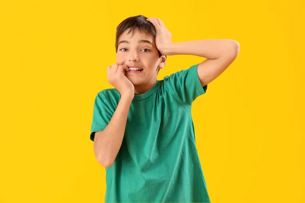Little Boy Biting Nails Yellow Background — 스톡 사진
