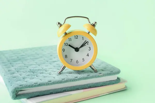 Notebooks Alarm Clock Color Background Closeup — Stock Photo, Image