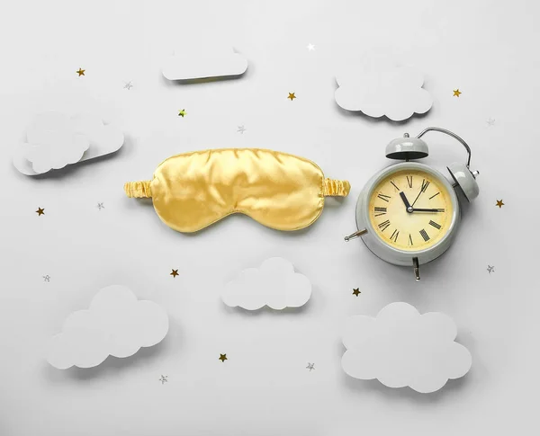 Composition Sleeping Mask Alarm Clock Paper Clouds Confetti Light Background — Stockfoto