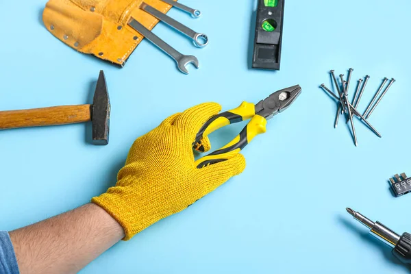 Male Hand Gloves Holding Pliers Different Instruments Blue Background — Stock Photo, Image