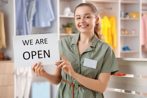 Female Sales Consultant Opening Sign Boutique — Stock Photo, Image