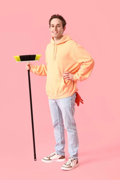 Young Man Broom Pink Background — Stock Photo, Image