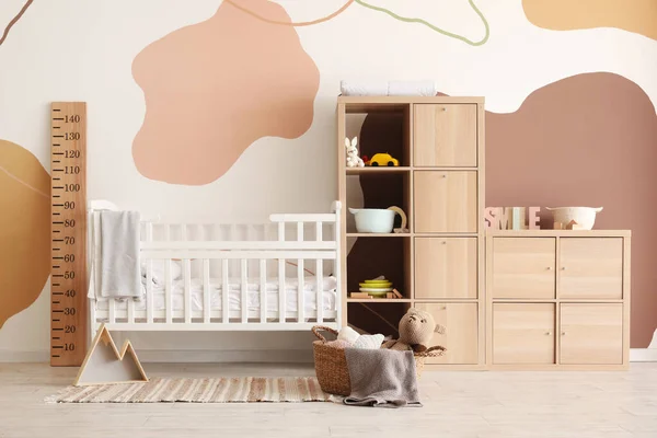 stock image Interior of children's bedroom with bed and shelving unit