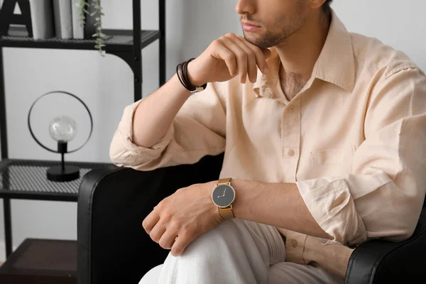 Stylish Young Man Wristwatch Sitting Armchair Room — Stock Photo, Image