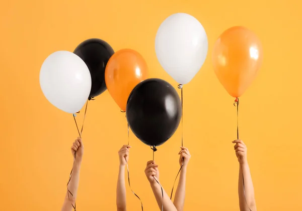 Female Hands Different Halloween Balloons Orange Background — Stock Photo, Image
