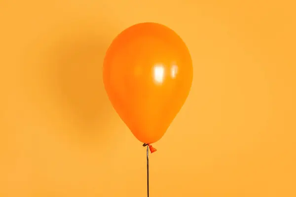 Halloween balloon on orange background