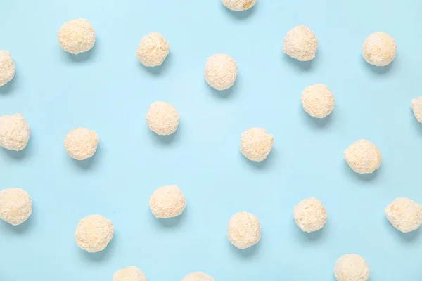 Many White Chocolate Candies Coconut Topping Blue Background — Stock Photo, Image