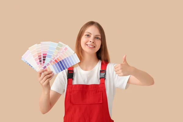 Female Decorator Color Samples Showing Thumb Beige Background — Stock Photo, Image