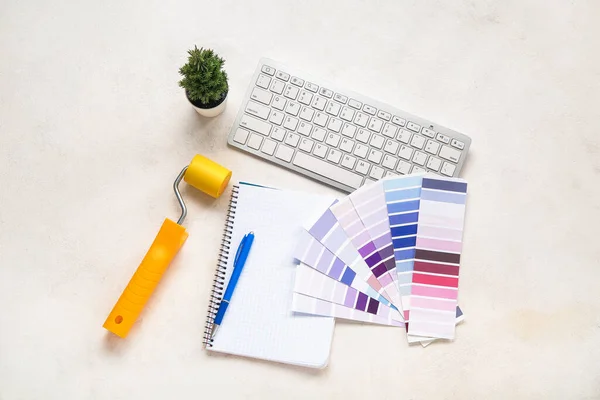 Many Color Palettes Keyboard Paint Roller Notebook Light Background Top — Stock Photo, Image