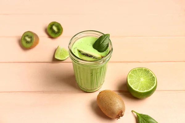 Glass Fresh Kiwi Smoothie Lime Basil Pink Wooden Background — Stockfoto