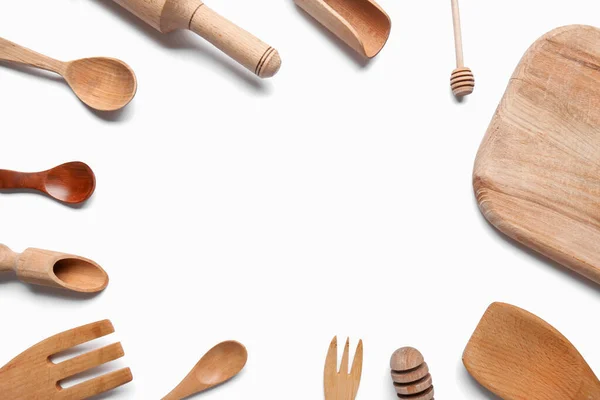 stock image Frame of wooden kitchen utensils on white background