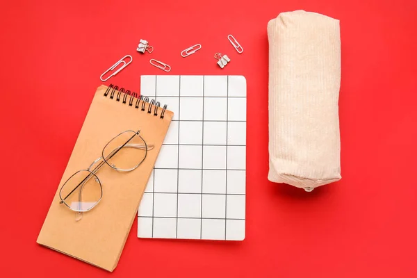 Composition Notebooks Pencil Case Eyeglasses Red Background — Stock Photo, Image