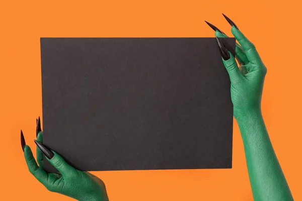 Hands Witch Blank Black Paper Sheet Orange Background Halloween Celebration — Stock Photo, Image