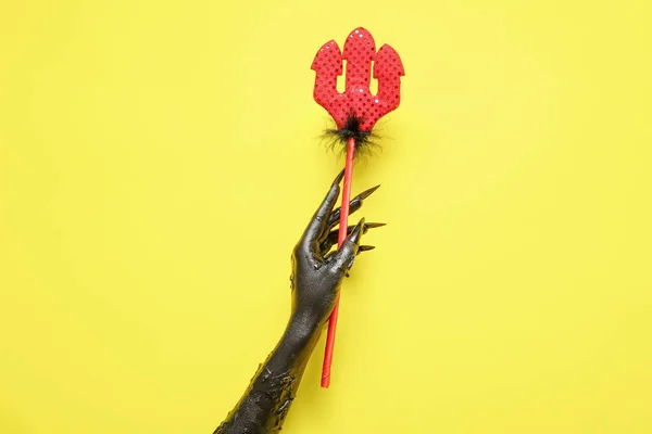 Black Hand Witch Devil Pitchfork Yellow Background Halloween Celebration — Stock Photo, Image