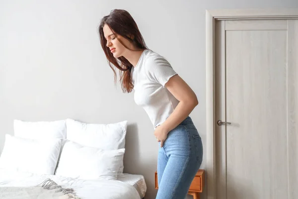 Young Woman Having Menstrual Cramps Bedroom — Stok fotoğraf