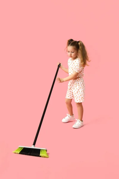 Cute Little Girl Sweeping Broom Pink Background — Stock Photo, Image
