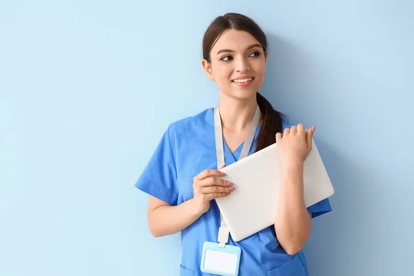 Female Medical Intern Laptop Blue Background — Stockfoto