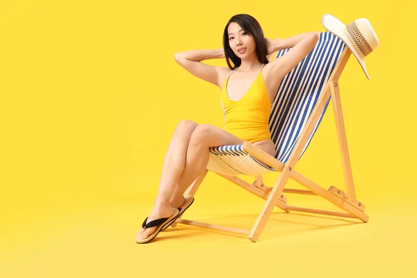 Beautiful Asian Woman Relaxing Deck Chair Yellow Background — Stock Photo, Image