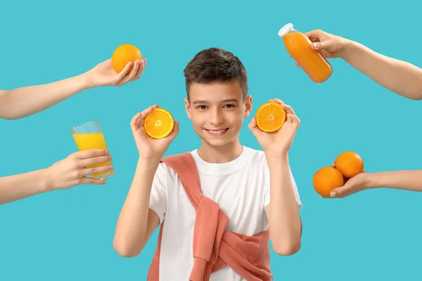 Little boy and hands with orange juice on blue background