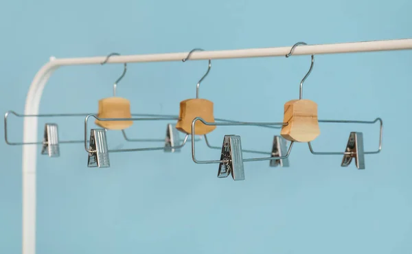Rack Metal Clothes Hangers Blue Background — Stock Photo, Image