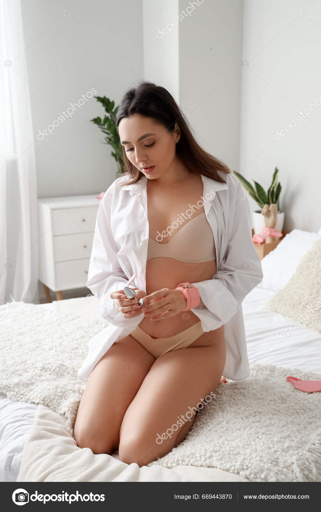 Young Woman Handcuffs Anal Plug Sitting Bed Home Stock Photo by ©serezniy  669443870