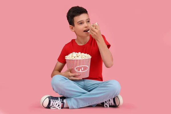 Cute Little Boy Eating Popcorn While Sitting Pink Background — Stock Photo, Image