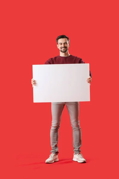 Handsome Man Big Blank Poster Red Background — Stock Photo, Image