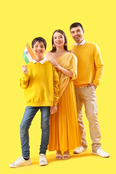 Happy family with Indian flag on yellow background