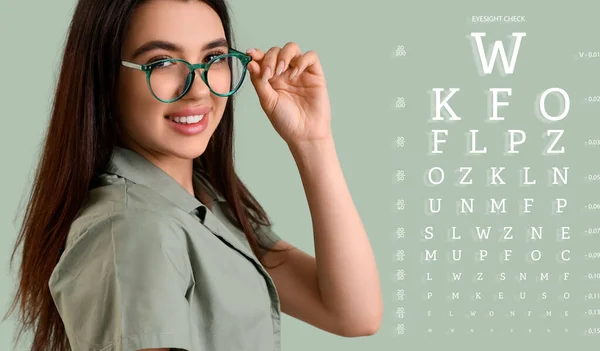 stock image Young woman in glasses and with eye test chart on color background