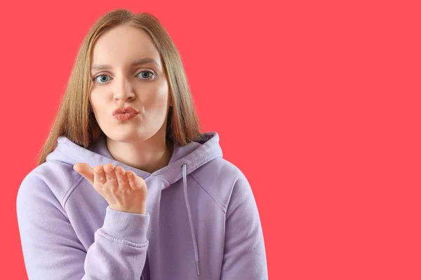 Beautiful Redhead Woman Hoodie Blowing Kiss Red Background Closeup — Stock Photo, Image
