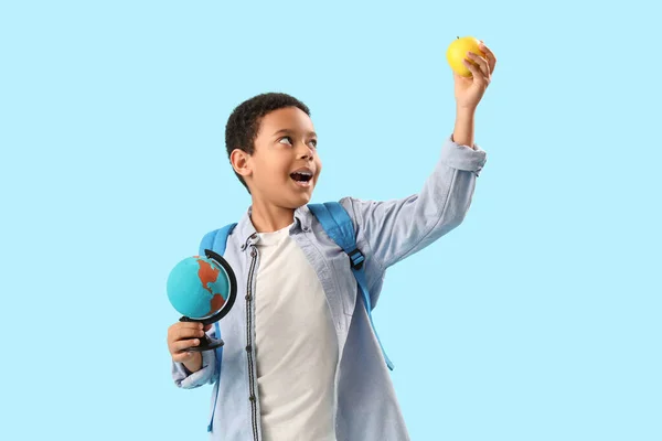 Little African American Schoolboy Globe Apple Light Blue Background — Stock Photo, Image