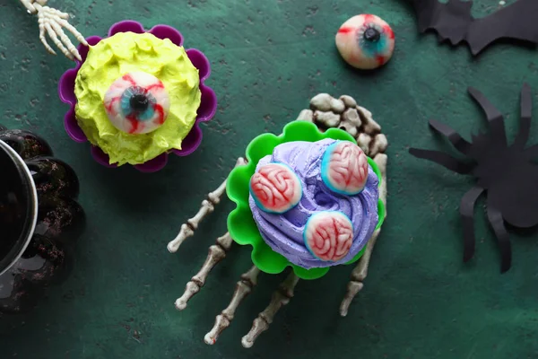 Composition Skeleton Hand Delicious Halloween Cupcakes Green Background Closeup — Stock Photo, Image