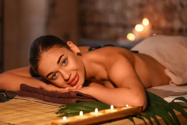 Pretty young woman in spa salon