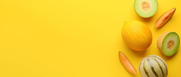 Tasty ripe melons on yellow background with space for text, top view