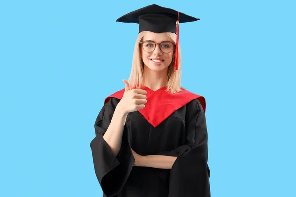 Female Graduate Student Showing Thumb Blue Background — Stock Photo, Image
