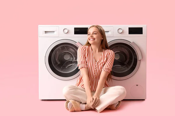 Happy Young Woman Sitting Washing Machines Pink Background — Stock Photo, Image