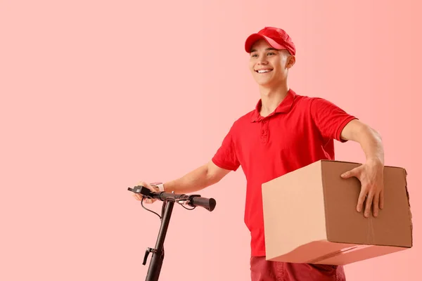 Young Courier Parcel Scooter Pink Background — Stock Photo, Image