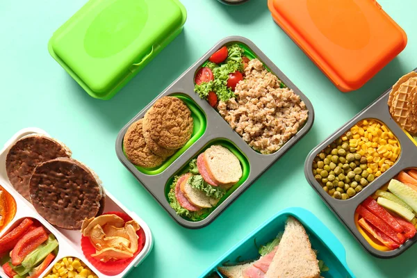Many Lunchboxes Different Delicious Food Turquoise Background — Stock Photo, Image