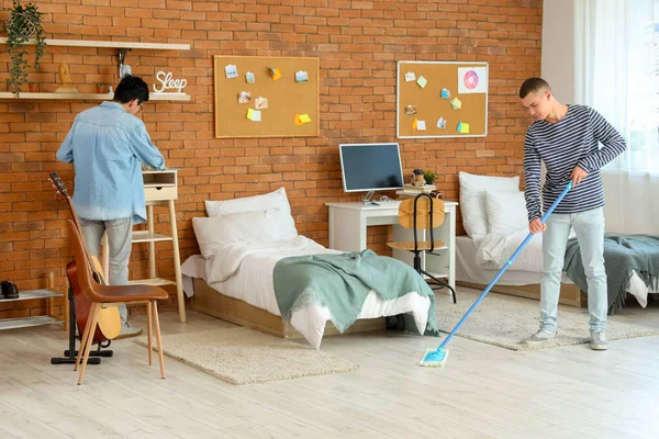 Male Students Cleaning Dorm Room — Stock Photo, Image