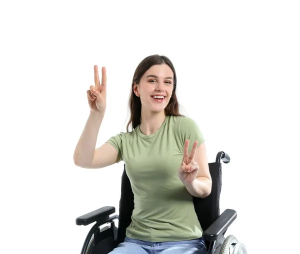 Молодая Женщина Инвалидной Коляске Показывает Победный Жест Белом Фоне — стоковое фото
