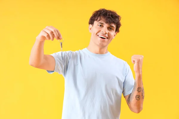 Happy Young Man Keys House Yellow Background — Stock Photo, Image