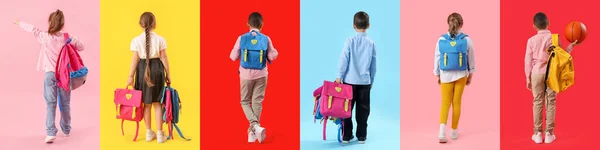 カラーバックグラウンド トップビューにバックパックを持つ小さな学校の子供のセット — ストック写真