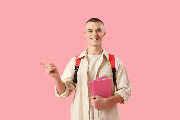 Happy Male Student Backpack Notebooks Pointing Something Pink Background — Stock Photo, Image