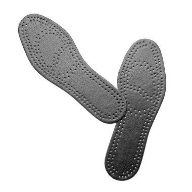 Beyaz arkaplanda bir çift siyah ortopedik taban