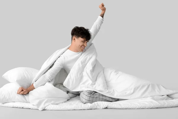 Awaking Handsome Happy Man Soft Blanket Pillow Grey Background — Stock Photo, Image