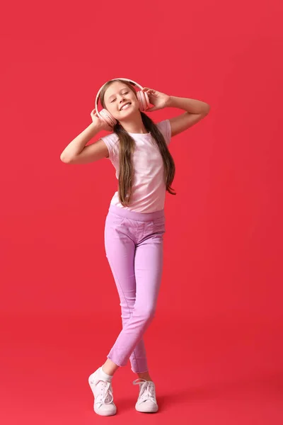 Little Girl Headphones Red Background — Stock Photo, Image