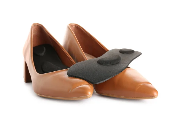 Par Zapatos Femeninos Con Plantillas Ortopédicas Sobre Fondo Blanco —  Fotos de Stock