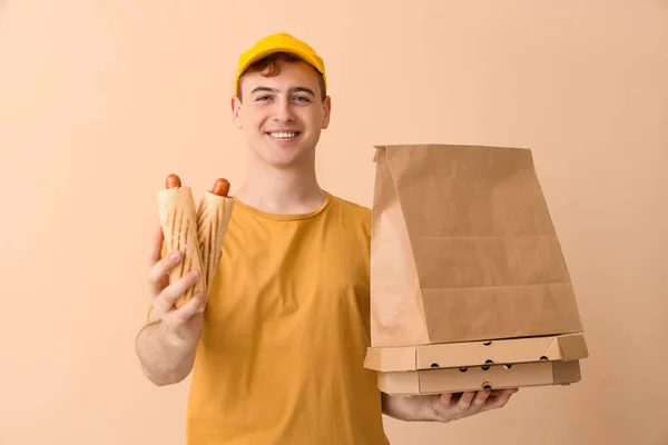 Delivery Service Worker Tasty Food Beige Background — Stock Photo, Image